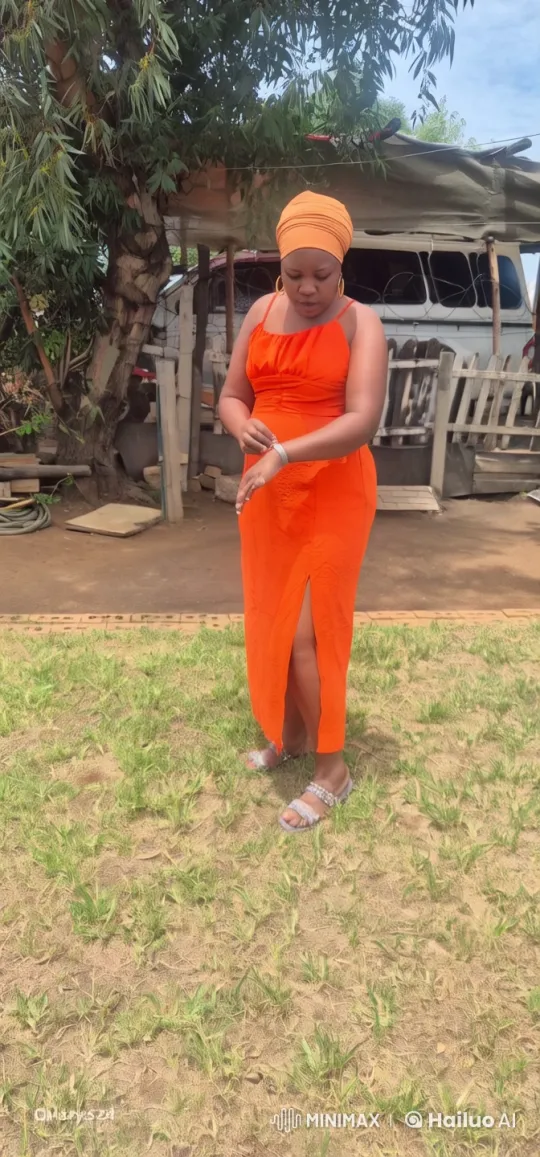 Woman in Orange Dress Performs Graceful Martial Arts – AI Generated Video | Hailuo AI