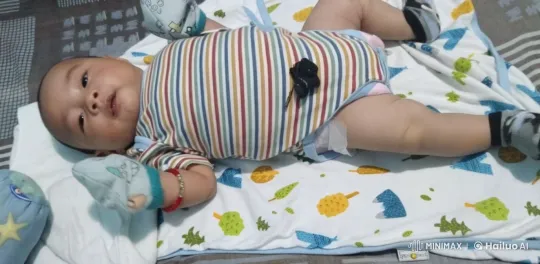 Baby Moves Gently on Patterned Blanket – AI Generated Video | Hailuo AI