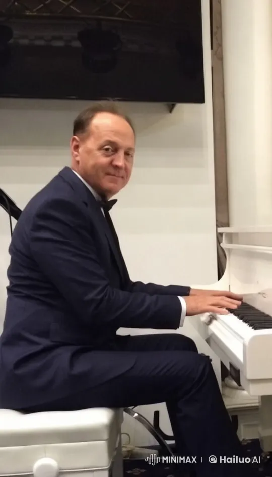 Man in Suit Plays Elegant Melody at Grand Piano – AI Generated Video | Hailuo AI