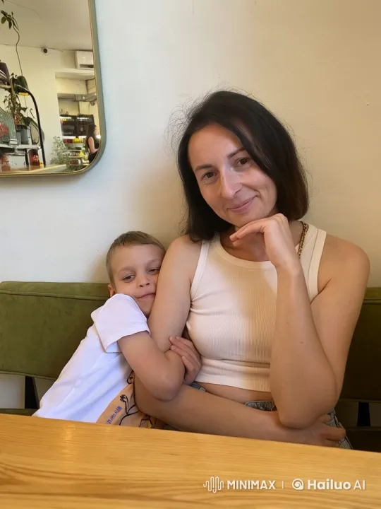 Cozy Cafe Scene: Girl and Child Intimate Moment – AI Generated Video | Hailuo AI