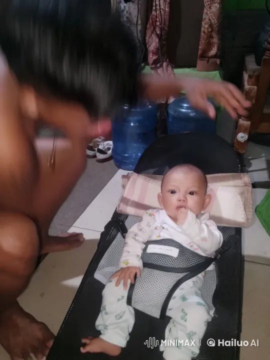 Baby in Rocker Mimics Kungfu with Caregiver – AI Generated Video | Hailuo AI