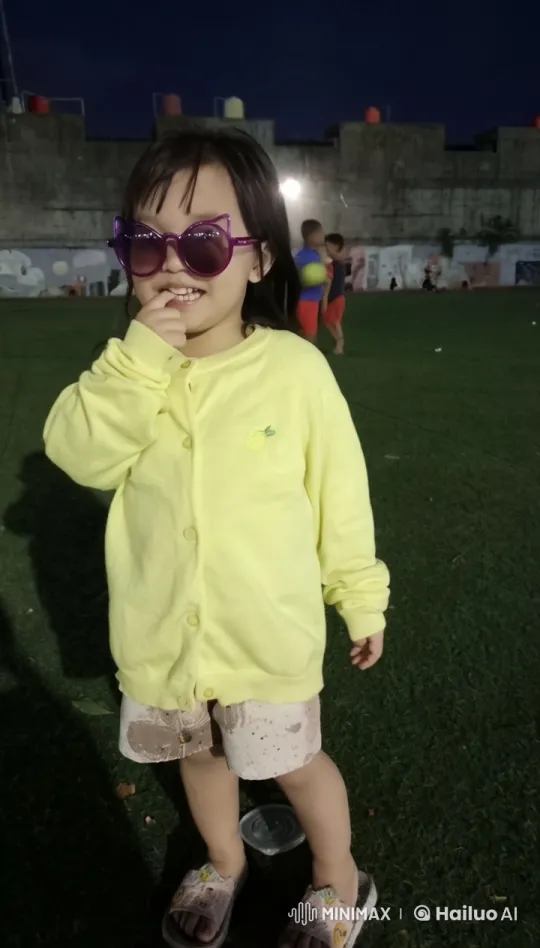 Child in Thoughtful Pose on Nocturnal Playground – AI Generated Video | Hailuo AI