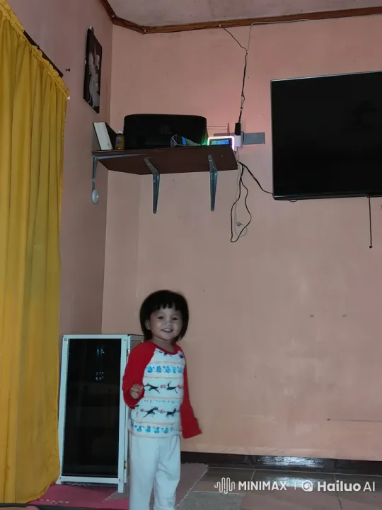 Child Practicing Kung Fu in Festive Pajamas in Cozy Room – AI Generated Video | Hailuo AI