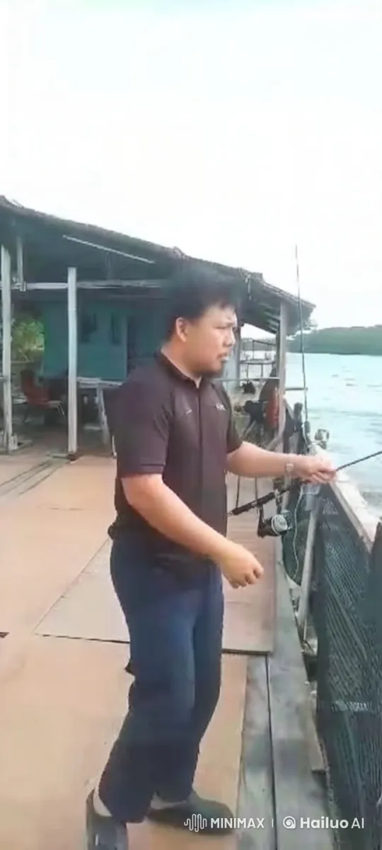 Man Leaps Gracefully into River with Fishing Rod – AI Generated Video | Hailuo AI