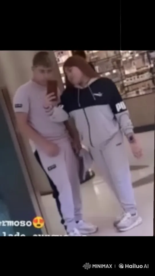 Affectionate Couple in Sporty Outfits in Shopping Mall – AI Generated Video | Hailuo AI