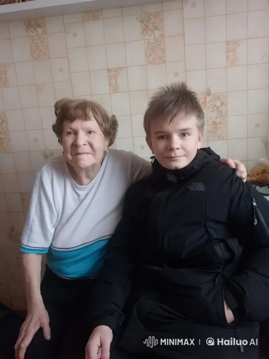 Elderly Woman and Young Man Share Comforting Embrace – AI Generated Video | Hailuo AI