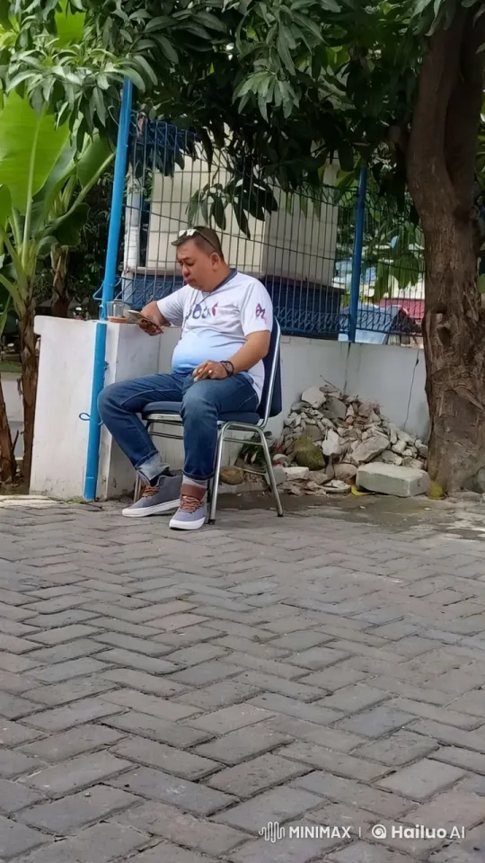 Man Sits and Dances in Sadness, Asking for Help – AI Generated Video | Hailuo AI