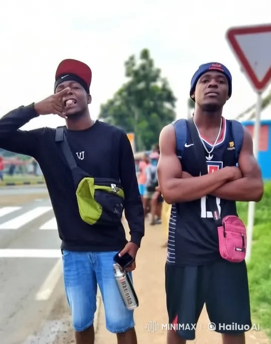 Two Young Men Standing Casual on Roadside – AI Generated Video | Hailuo AI