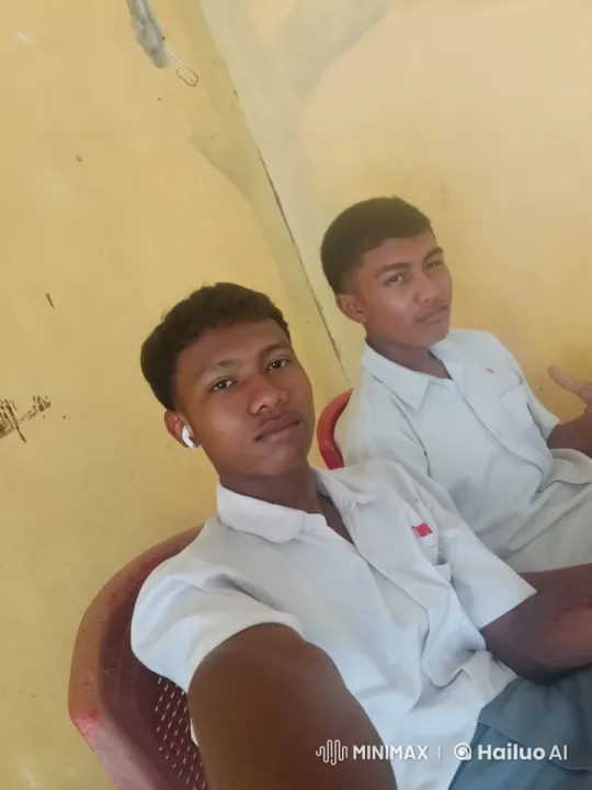 Two Men in White Shirts Relaxing in Minimalist Indoor Setting – AI Generated Video | Hailuo AI