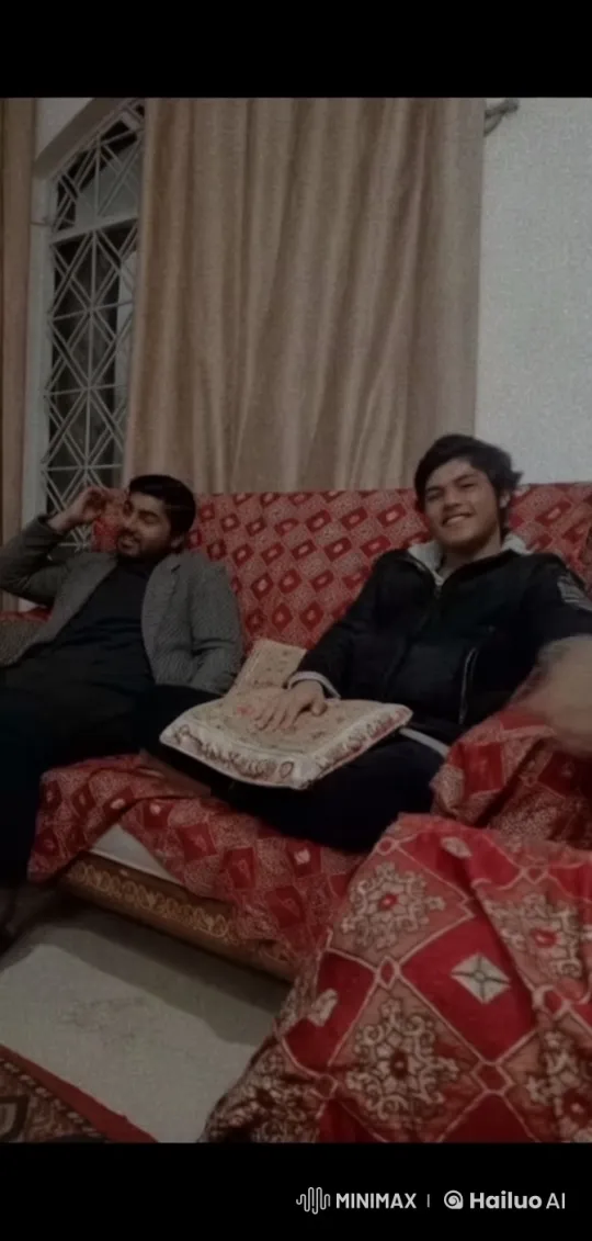 Two Men Share an Intimate Moment on a Patterned Sofa – AI Generated Video | Hailuo AI