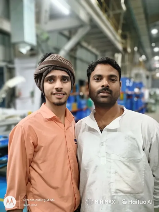 Affectionate Moment Between Two Men in Industrial Setting – AI Generated Video | Hailuo AI