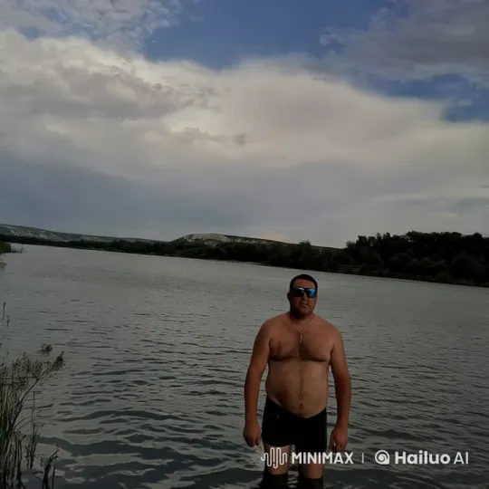 Man in Lake, Ship Sails by, Tranquil Scene with Adventure – AI Generated Video | Hailuo AI