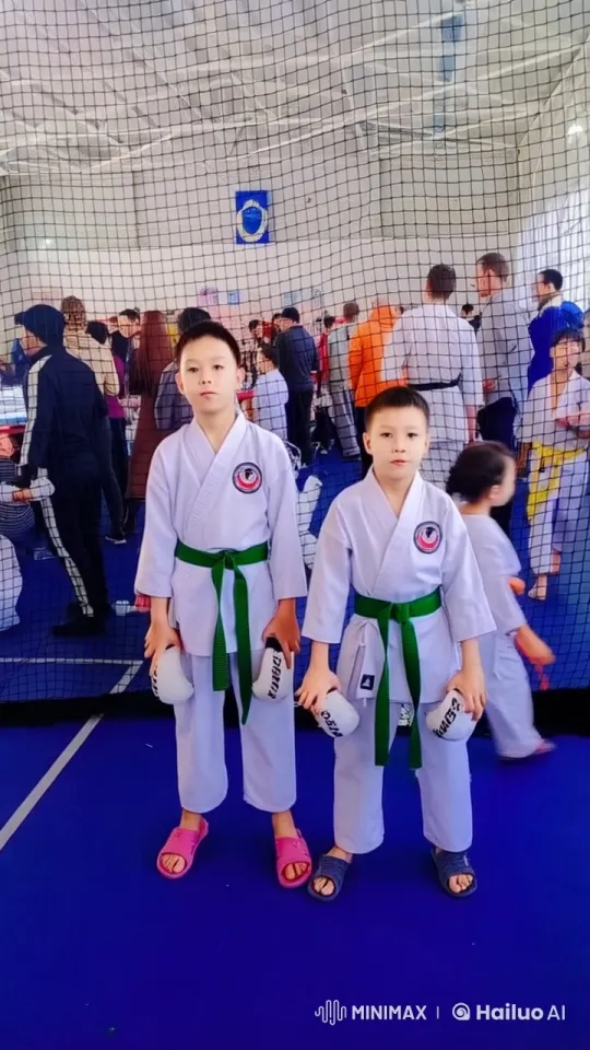 Energetic Karate Boys Spar in Bustling Dojo – AI Generated Video | Hailuo AI