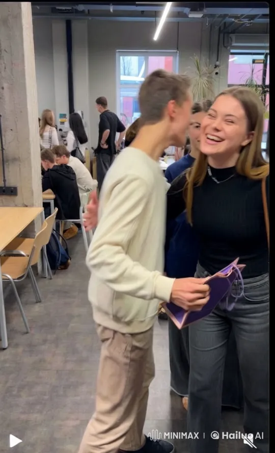 Young Couple Kisses in Lively Indoor Setting – AI Generated Video | Hailuo AI