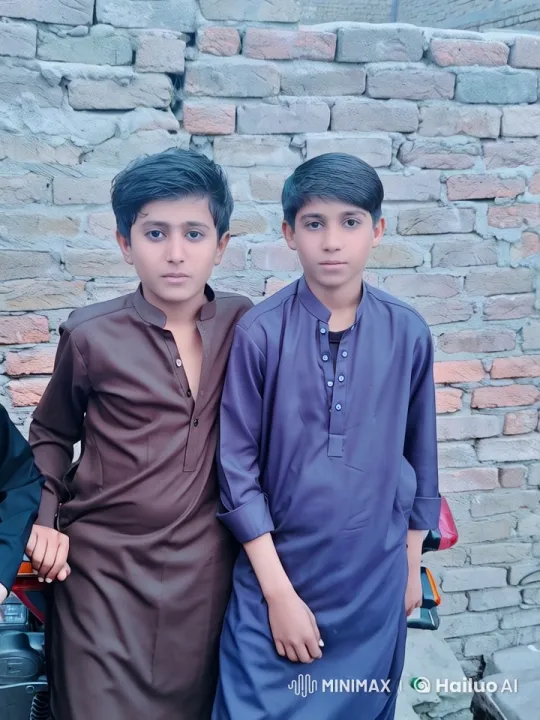 Two Boys in Traditional Attire Stand Together – AI Generated Video | Hailuo AI