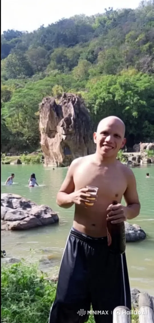 Shirtless Man Dances Energetically by Lush Riverside – AI Generated Video | Hailuo AI