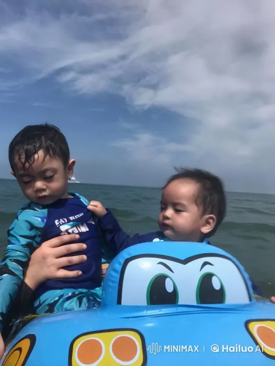 Superhero Boys Display Kung Fu on Inflatable at Seaside – AI Generated Video | Hailuo AI