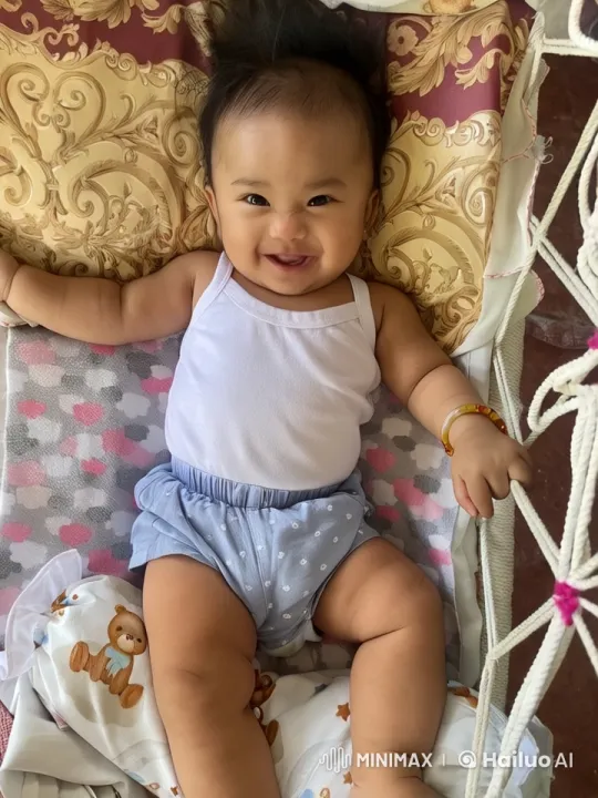 Baby Dancing Joyfully on Patterned Pillow – AI Generated Video | Hailuo AI