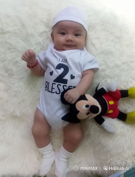 Baby in White Onesie Dances with Mickey Toy – AI Generated Video | Hailuo AI