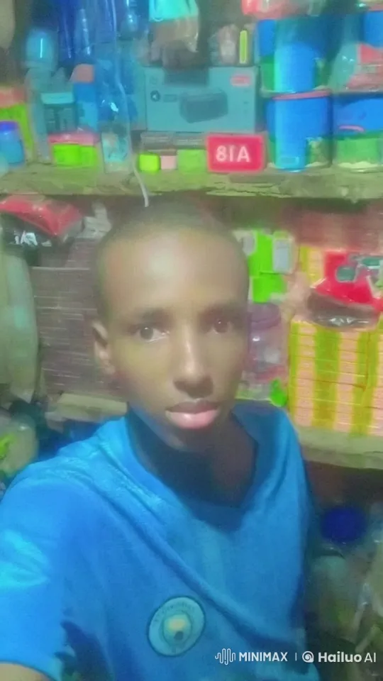 Young Person Taking Selfie in a Cluttered Store – AI Generated Video | Hailuo AI