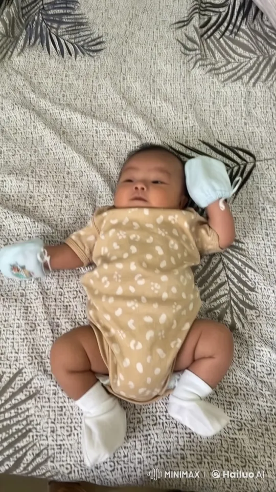 Adorable Baby Dances and Pounds Joyfully on Bedspread – AI Generated Video | Hailuo AI