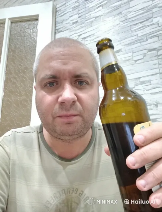 Man Relaxing Indoors with Beer Bottle – AI Generated Video | Hailuo AI
