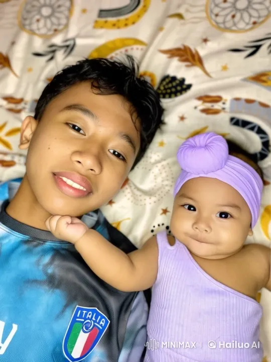 Affectionate Siblings on a Patterned Blanket – AI Generated Video | Hailuo AI
