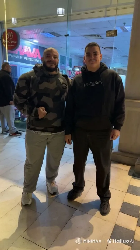 Friends Enjoy Mall Time, Share Camaraderie in Handshake – AI Generated Video | Hailuo AI