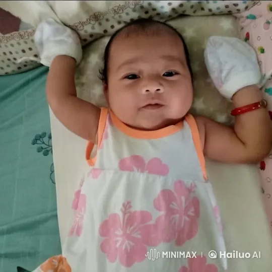 Baby Dancing Playfully in Cute Dress on Patterned Bed – AI Generated Video | Hailuo AI