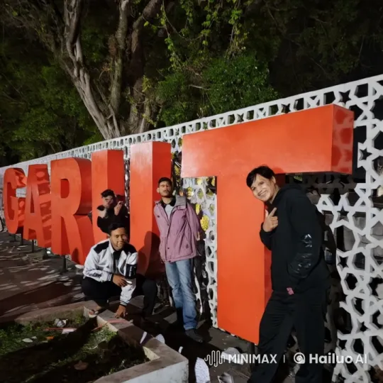 Four Friends Enjoying Night at Garut Sign – AI Generated Video | Hailuo AI