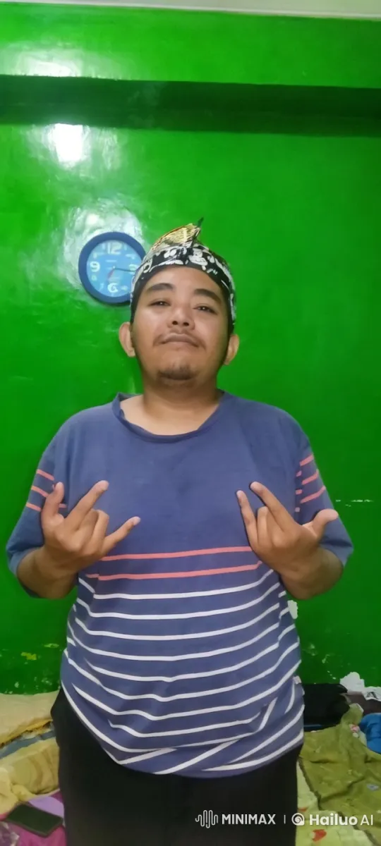 Person in Striped Shirt Poses with Rock Gestures – AI Generated Video | Hailuo AI