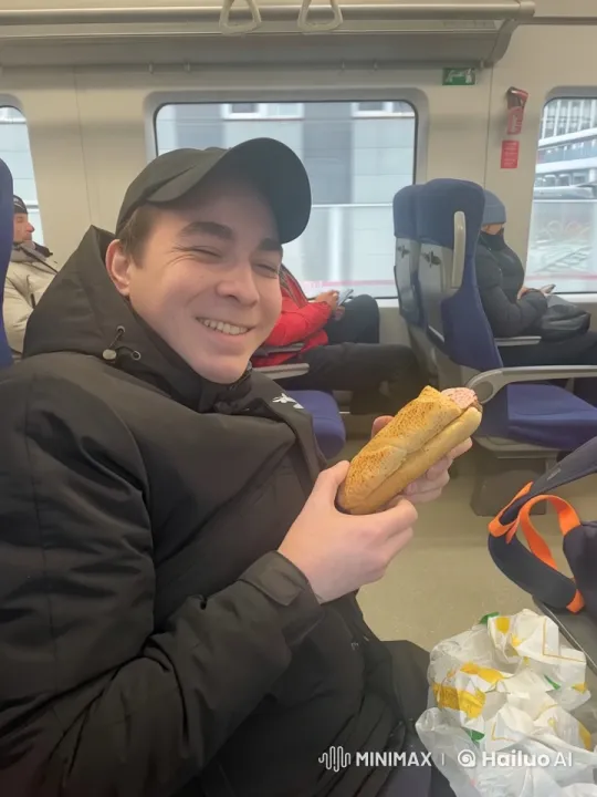Passenger Enjoying Sandwich on Moving Train – AI Generated Video | Hailuo AI