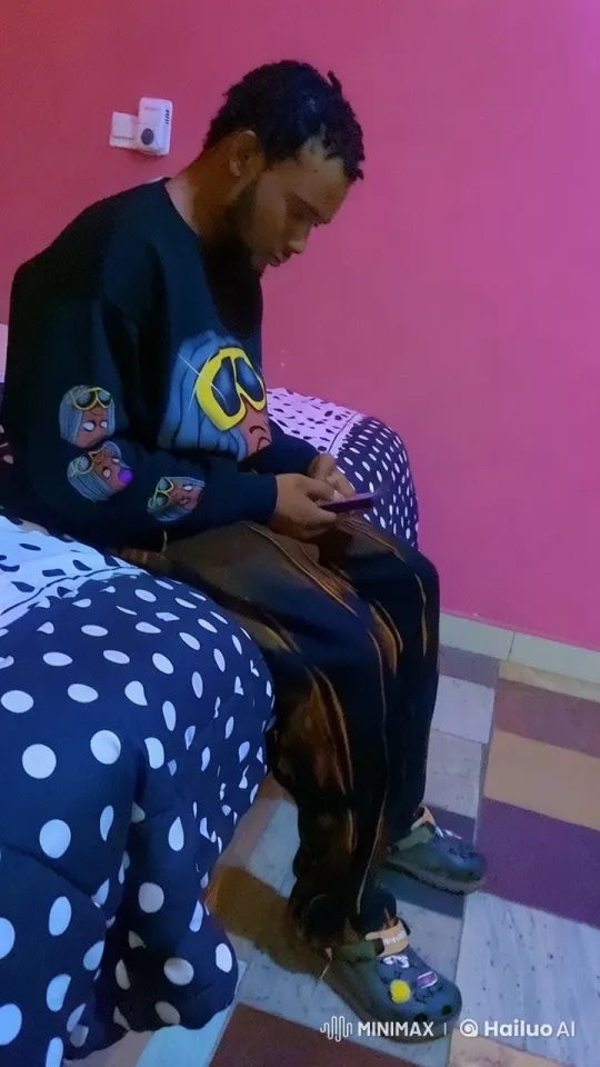 Cozy Room: Person on Bed with Dynamic Clothing – AI Generated Video | Hailuo AI