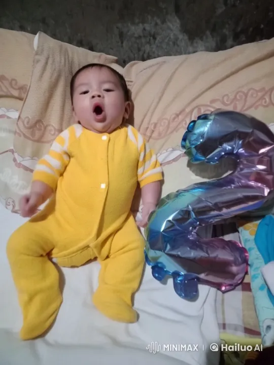 Baby Dances with Joy on Cozy Bed with Balloon – AI Generated Video | Hailuo AI