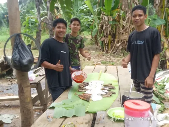 Young Men Enjoy Outdoor Meal with Grilled Fish – AI Generated Video | Hailuo AI