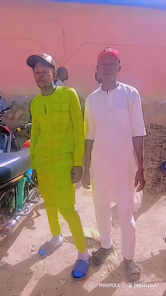 Two Men in Traditional Attire Stand Outdoors – AI Generated Video | Hailuo AI