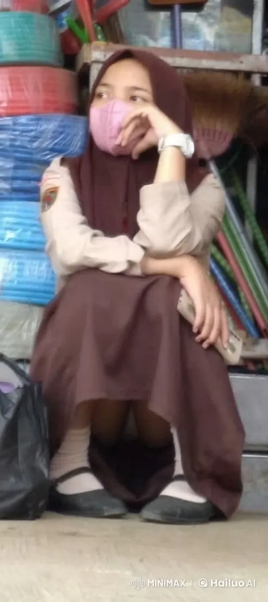 Young Girl Sitting in Shop, Using Phone – AI Generated Video | Hailuo AI