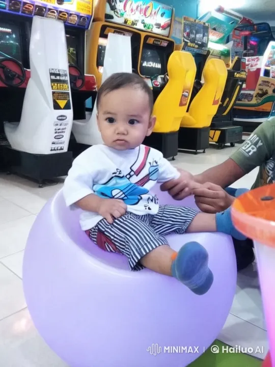 Child Performs Playful Kung Fu in Arcade Setting – AI Generated Video | Hailuo AI