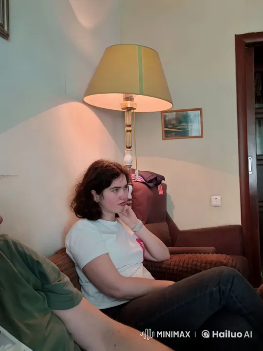 Cozy Living Room Scene with Person on Sofa – AI Generated Video | Hailuo AI