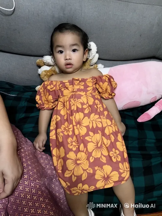 Child Dancing Energetically in Floral Dress on Couch – AI Generated Video | Hailuo AI