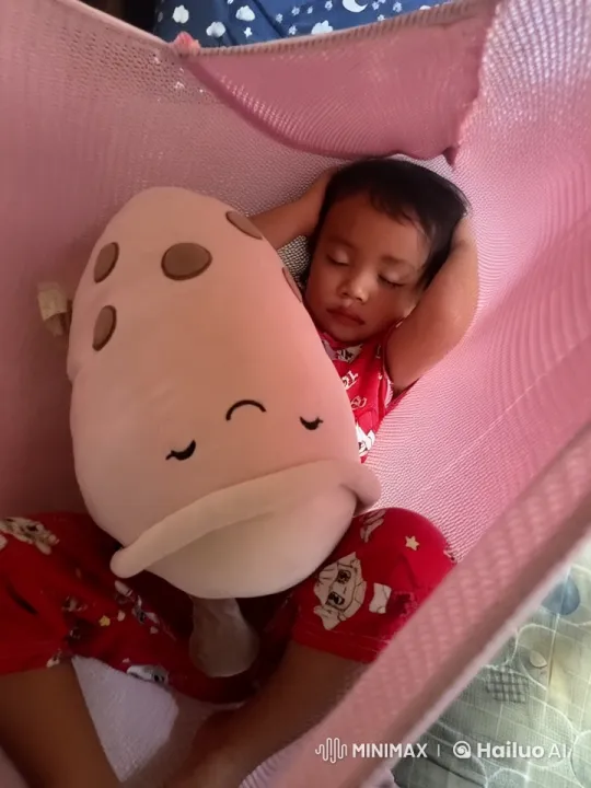 Child Dancing with Plush Toy in Hammock – AI Generated Video | Hailuo AI