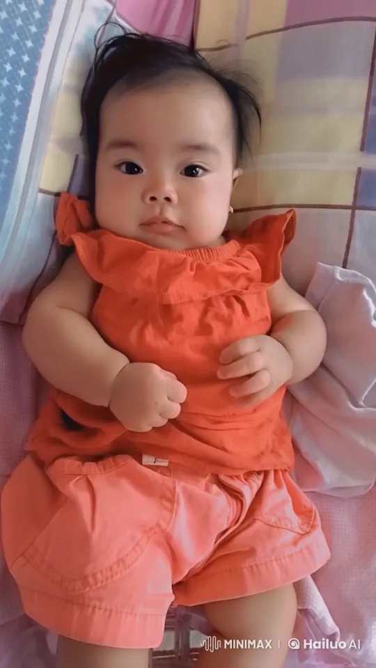 Baby Practicing Kungfu on Patterned Bedspread – AI Generated Video | Hailuo AI