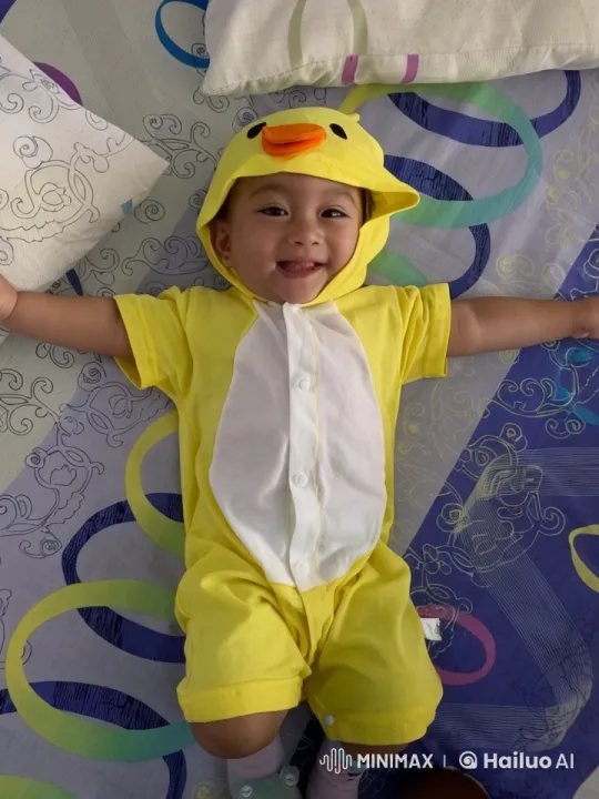 Child in Duck Onesie Dancing on Bed – AI Generated Video | Hailuo AI