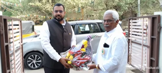 Formal Man Gifts Flowers to Elderly in Festive Urban Setting – AI Generated Video | Hailuo AI