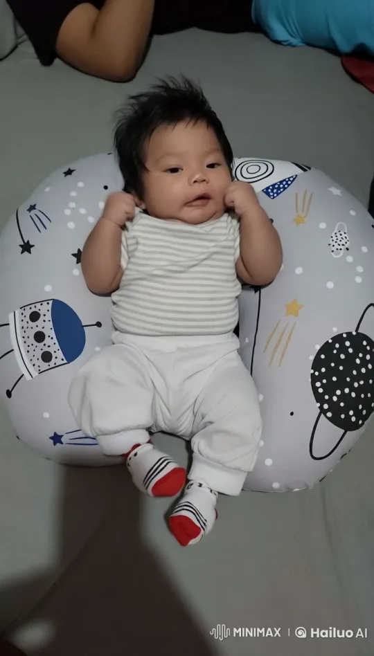 Baby Dancing Joyfully on Space-Themed Cushion – AI Generated Video | Hailuo AI