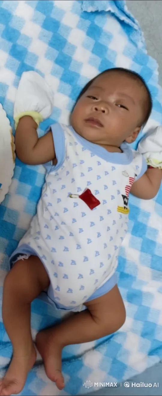 Baby Stands and Sways Gently on Checkered Blanket – AI Generated Video | Hailuo AI