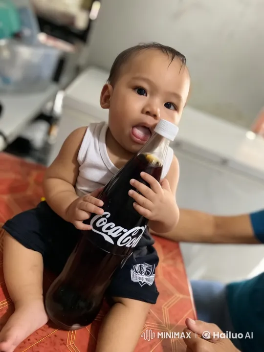 Child Dancing with Coca-Cola Bottle in Live2D Animation – AI Generated Video | Hailuo AI