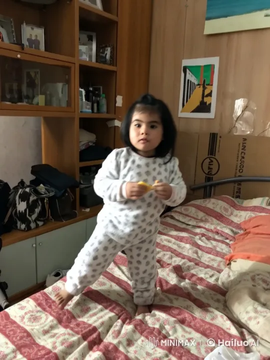 Child Enthusiastically Dancing on Bed in Animated Video – AI Generated Video | Hailuo AI