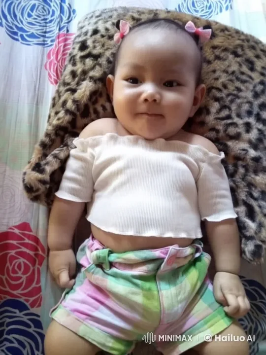 Live2D Animation: Peaceful Baby Resting on Patterned Blanket – AI Generated Video | Hailuo AI