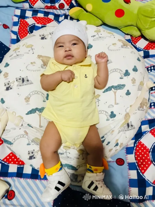 Baby Dancing with Punches on Patterned Blanket – AI Generated Video | Hailuo AI